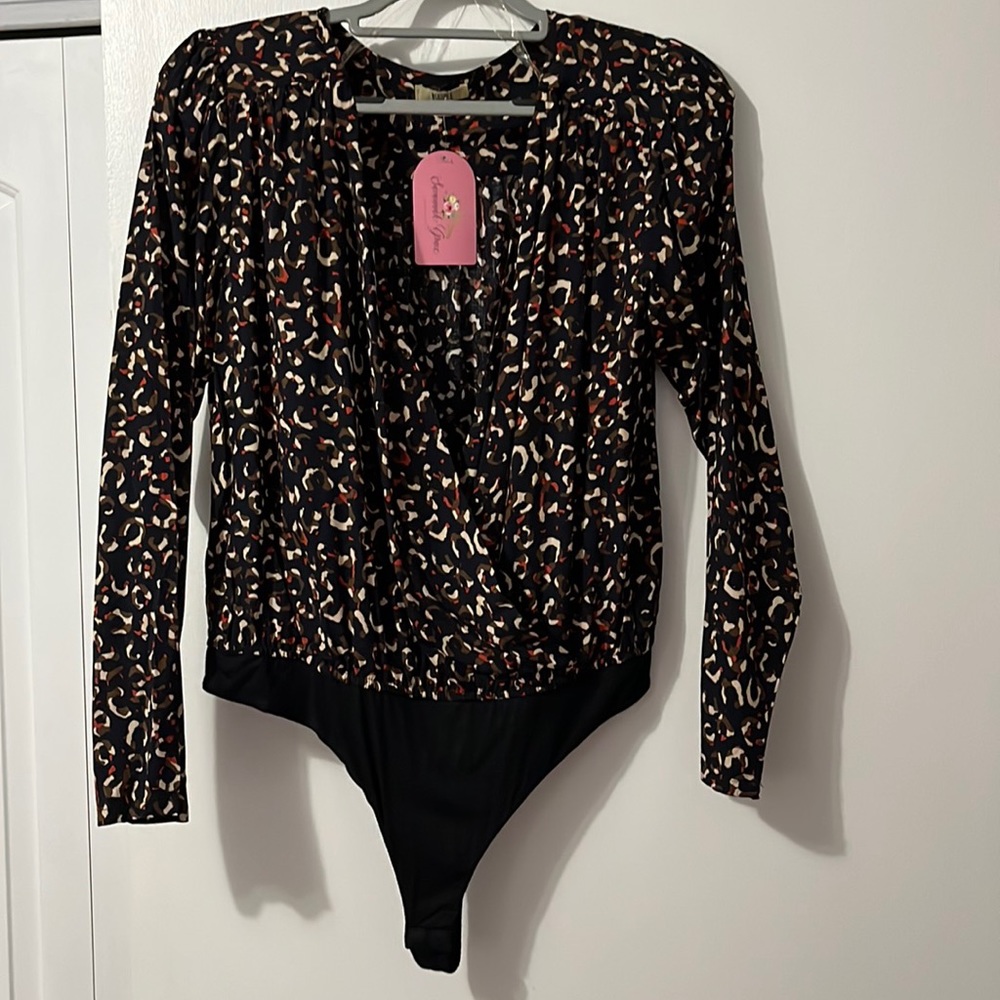 One piece top/body suit - brand new with tags - black background